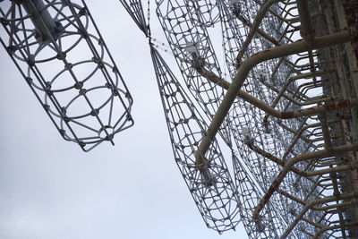 Low angle view of bare tree against sky