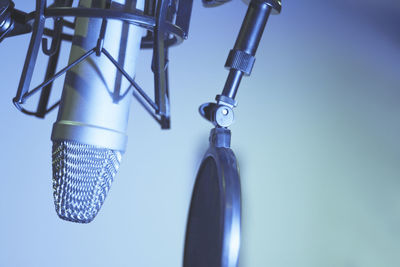 Professional microphone suspended in the air of professional studio