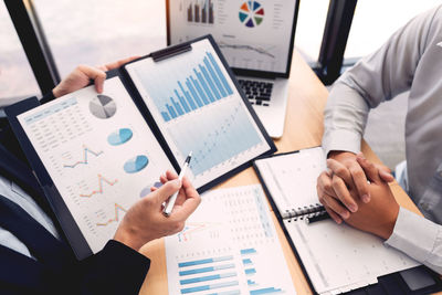 High angle view of business people working on table