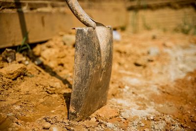 Close-up of old wooden post on field