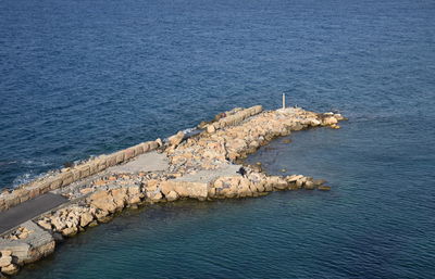 High angle view of groyne on sea