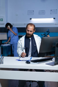 Portrait of doctor working at office