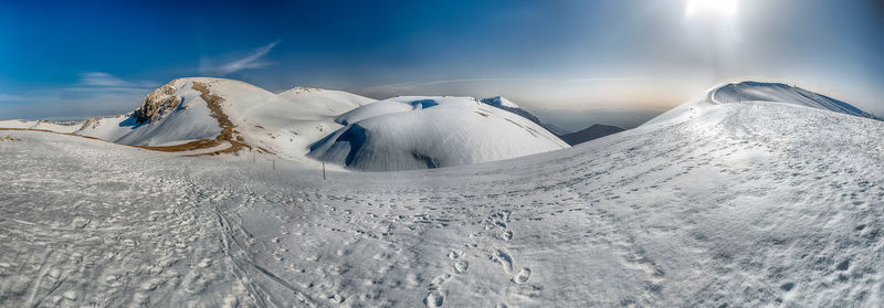 Snow covered mountain against sky