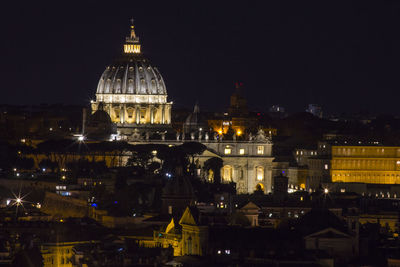 Illuminated buildings in city at night