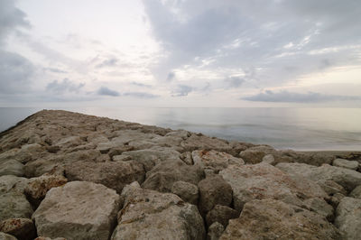 Scenic view of sea against cloudy sky