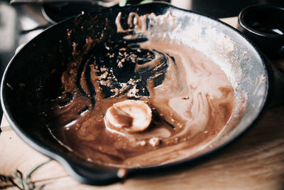 Close-up of dessert in skillet pan on table