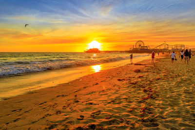 Scenic view of beach against sky during sunset