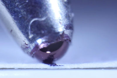 Macro shot of water drops on metal