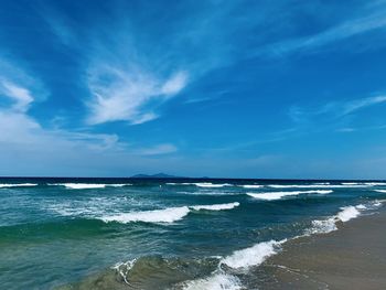 Scenic view of sea against blue sky