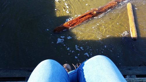 Low section of woman in water