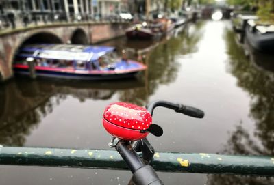Close-up of hand on boat in river
