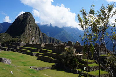 Scenic view of mountains against cloudy sky