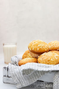 Vanilla muffins and muffins with streusel in paper cups with milk. breakfast or snack for children.