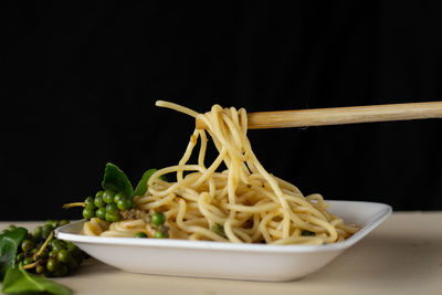 Close-up of noodles in bowl on table