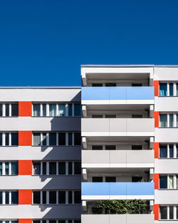 Low angle view of building against clear blue sky