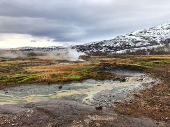 Wet landscape against sky