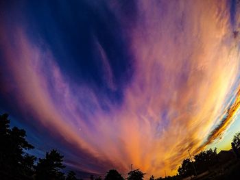 Low angle view of cloudy sky at sunset