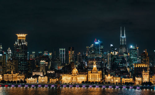 Illuminated city buildings at night