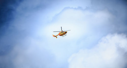 Low angle view of airplane flying in sky