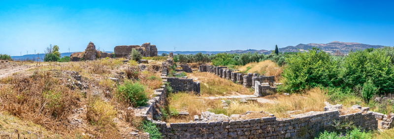 Panoramic view of historic building against blue sky