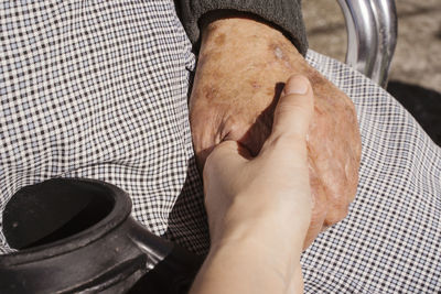 Close-up of people holding hands