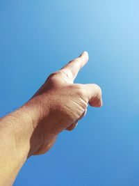 Midsection of person against blue background