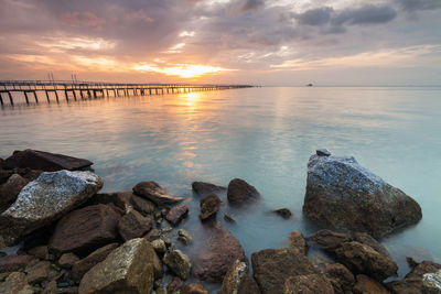 Scenic view of sea against sky at sunset