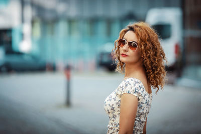 Portrait of young woman in sunglasses