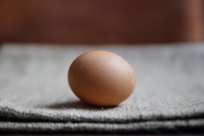 Close-up of egg on jute