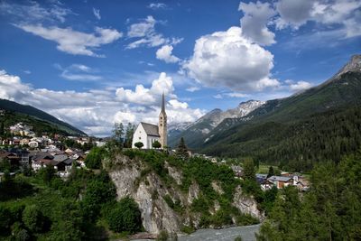 Panoramic view of trees and buildings against sky