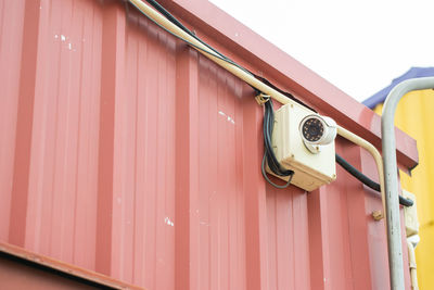 Low angle view of electric light on wall