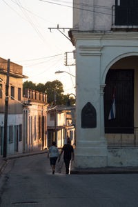 People walking in front of building