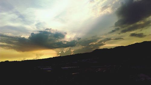 Silhouette landscape against sky during sunset