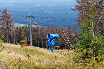 High angle view of overhead cable car in forest