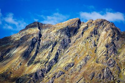 Low angle view of rock formation against sky