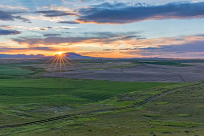 Scenic view of landscape against sky during sunset