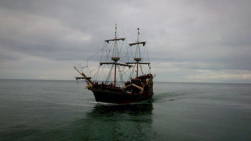 Ship moored on sea against sky