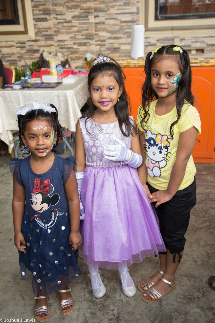 child, girls, looking at camera, portrait, childhood, children only, full length, togetherness, tradition, people, smiling, friendship, outdoors, day