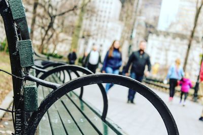 Close-up of people against trees