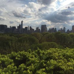 View of city against cloudy sky