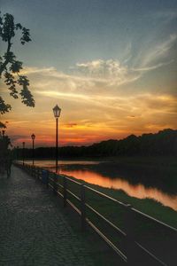 Scenic view of river against sky during sunset