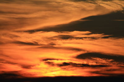 Low angle view of dramatic sky during sunset