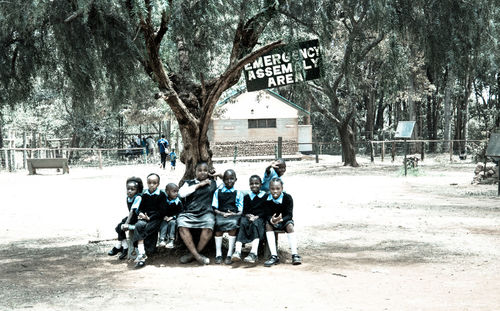 Men on swing in park