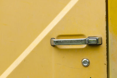 Close-up of yellow door