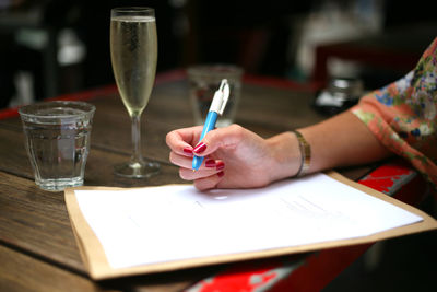 Close-up of hand on table