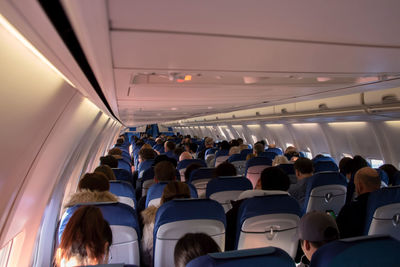 Group of people sitting in airplane