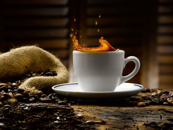 Close-up of coffee cup on table