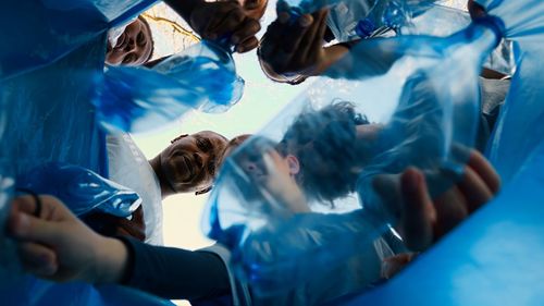 Cropped image of doctor examining patient in swimming pool