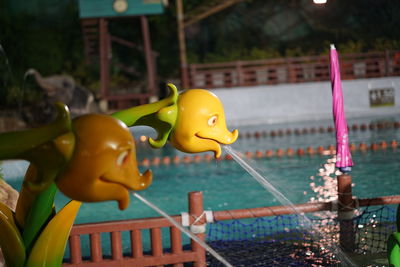 Close-up of yellow toys in amusement park