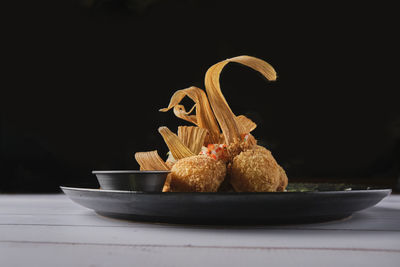 Close-up of food in plate on table